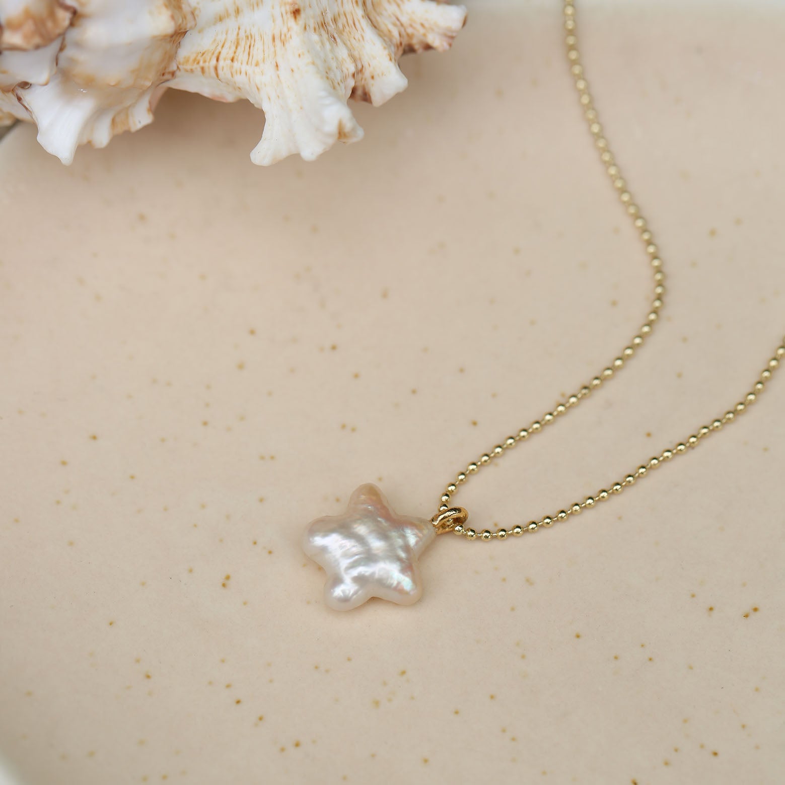 Star, moon and pearl pendant necklace